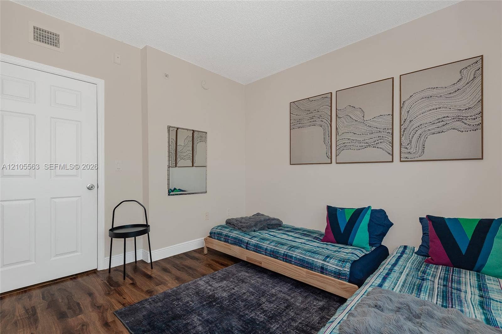 17145 N Bay Road, #4613, Sunny Isles Beach, Sunny Isles Beach, FL 33160 Hardwood-look flooring with light-toned walls and a white paneled door