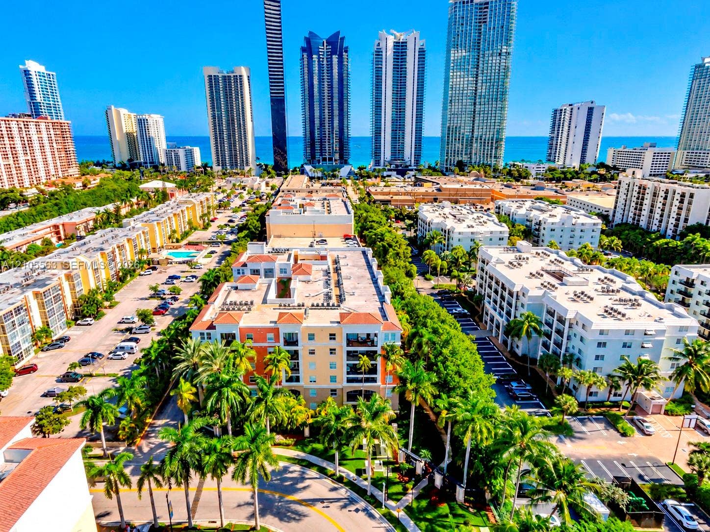 17145 N Bay Road, #4613, Sunny Isles Beach, Sunny Isles Beach, FL 33160 Coastal urban landscape featuring high-rise buildings, residential structures, and established landscaping