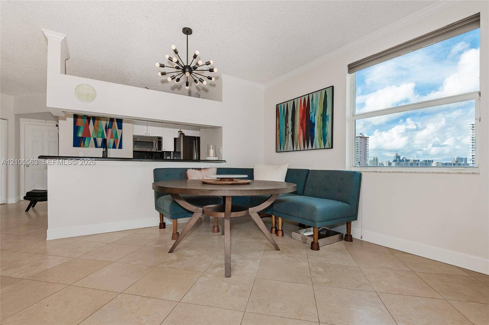 17145 N Bay Road, #4613, Sunny Isles Beach, Sunny Isles Beach, FL 33160 Tile flooring, large window, built-in breakfast bar, contemporary chandelier, recessed kitchen appliances