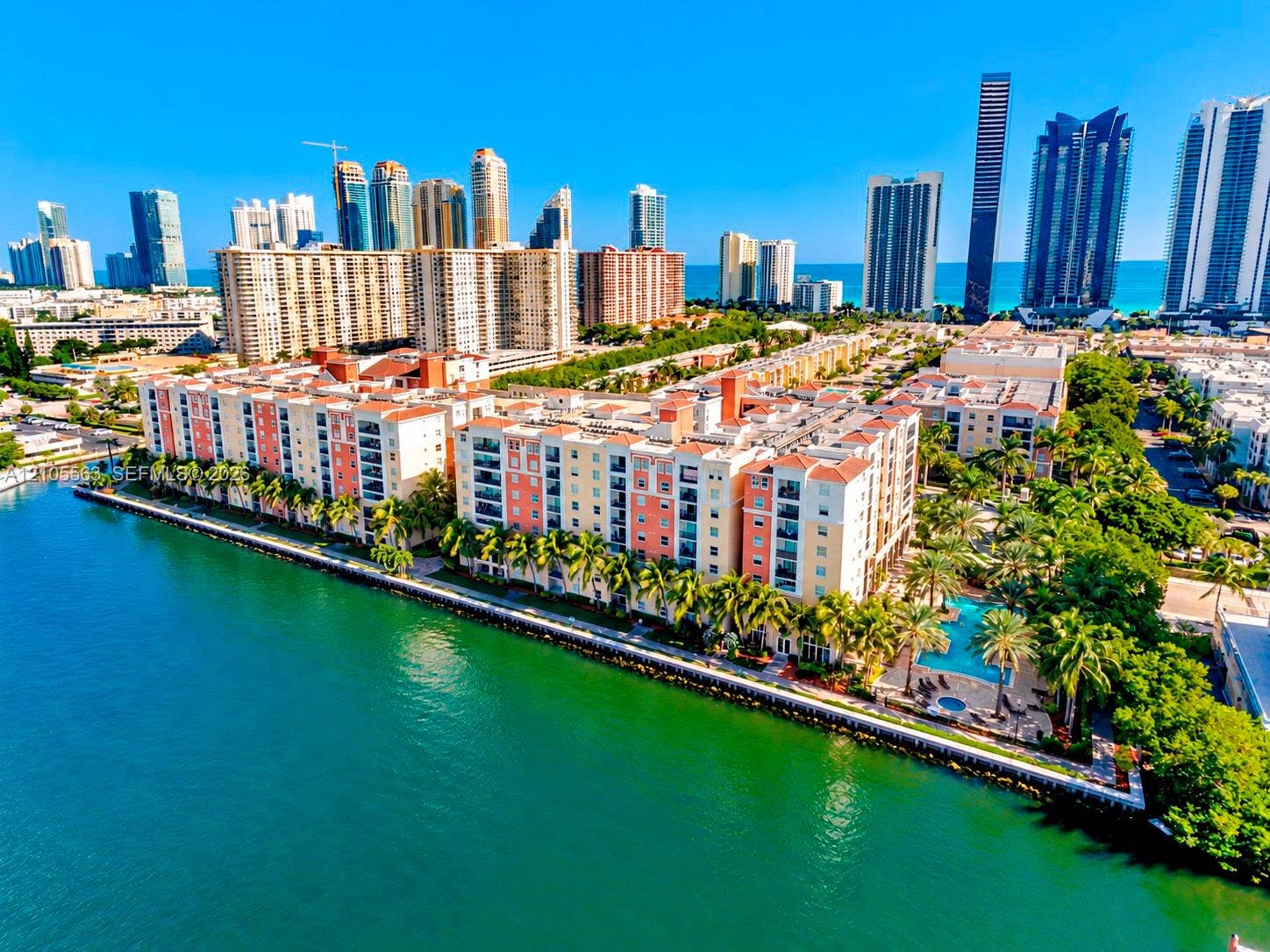 17145 N Bay Road, #4613, Sunny Isles Beach, Sunny Isles Beach, FL 33160 Waterfront property with multiple residential buildings, private balconies, and an outdoor swimming pool