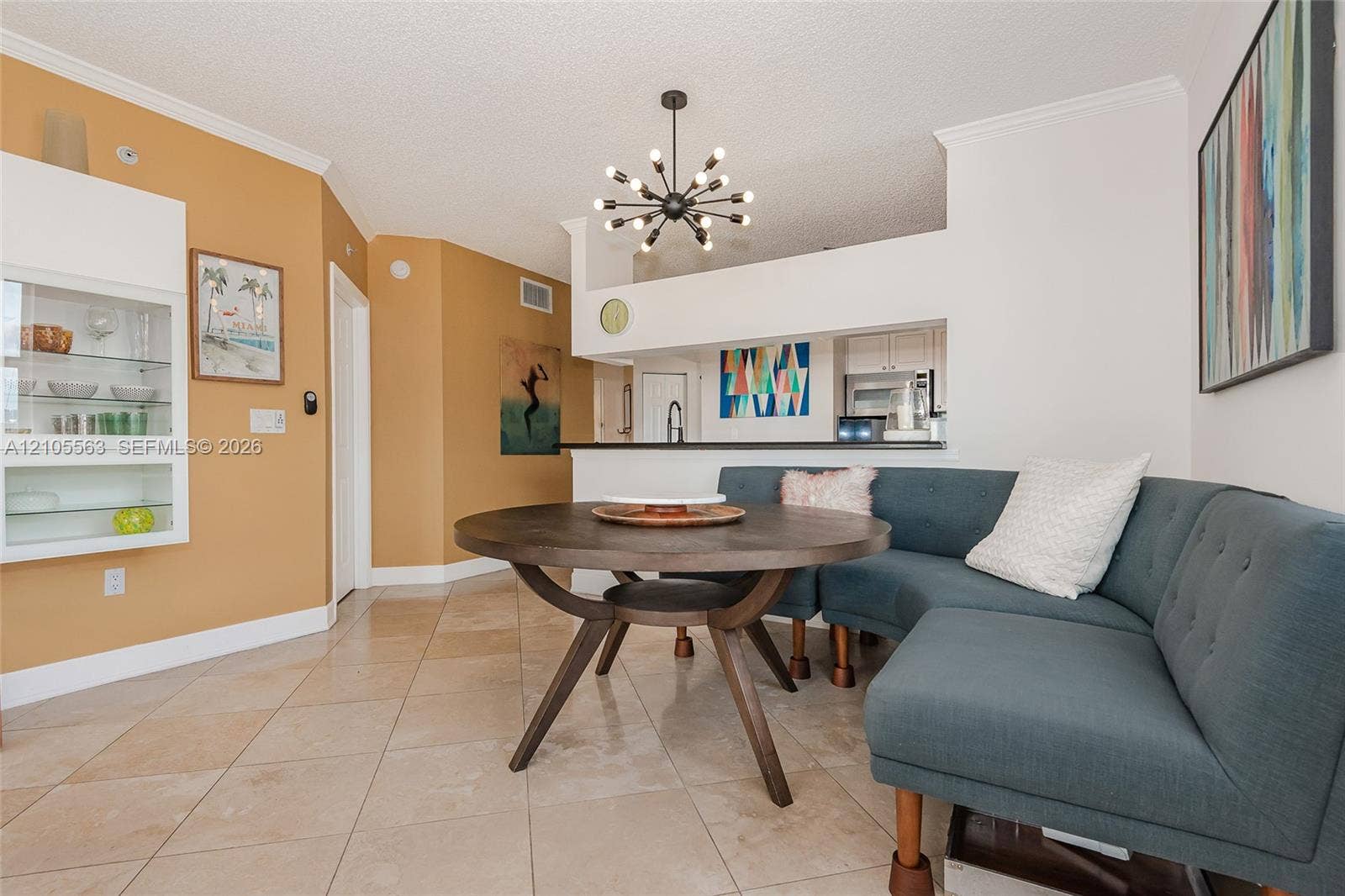 17145 N Bay Road, #4613, Sunny Isles Beach, Sunny Isles Beach, FL 33160 Neutral-toned tile flooring, white crown molding, and a modern ceiling light fixture