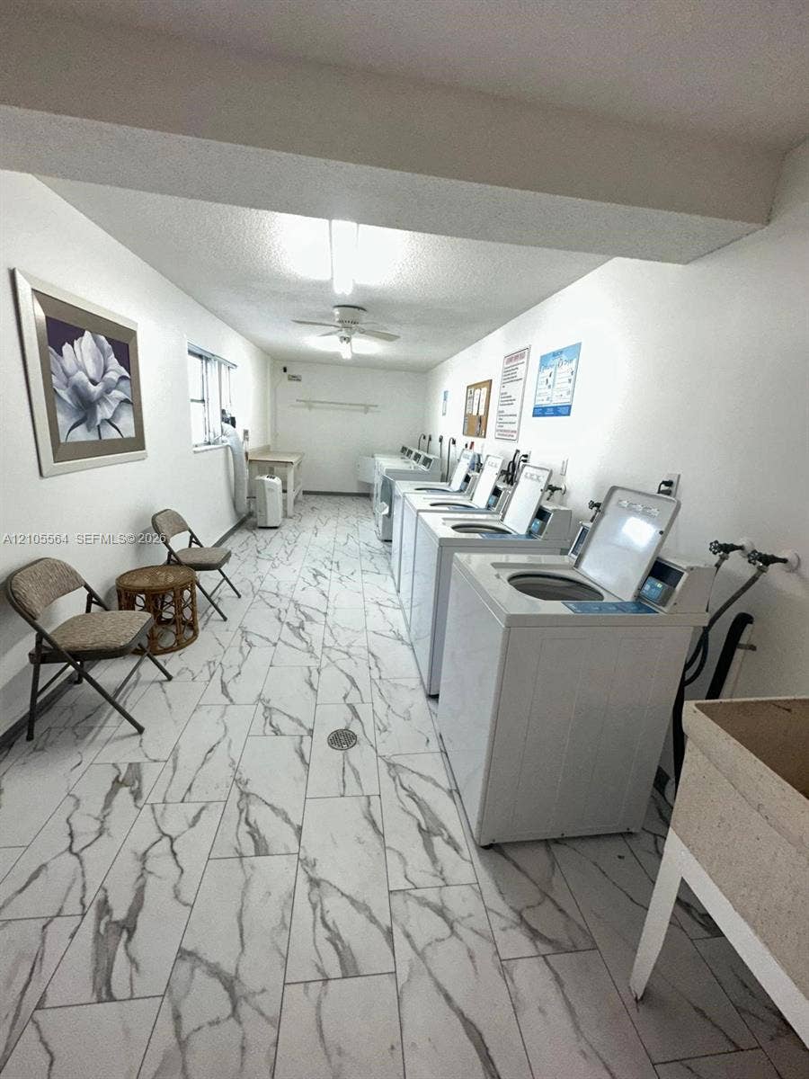White tile flooring with grey veining