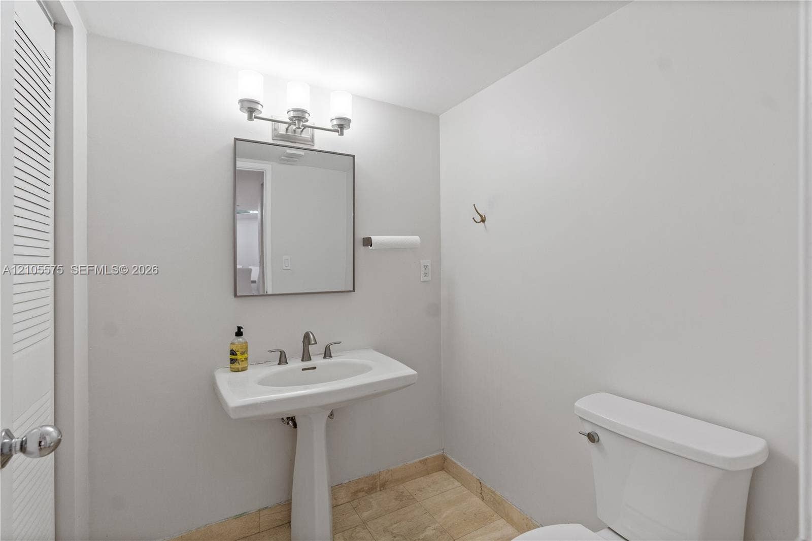Convenient guest powder room and in-unit washer and dryer, providing everyday comfort and functionality at Mystic Pointe in Aventura.