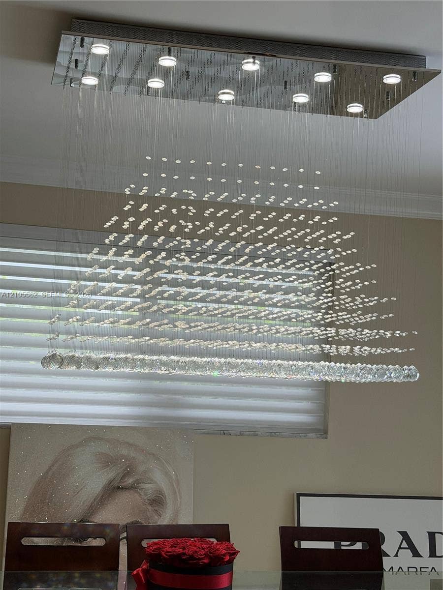 2215 NE 204th Street, Miami, Miami, FL 33180 Rectangular chrome ceiling light fixture with multiple integrated downlights and cascading crystal elements