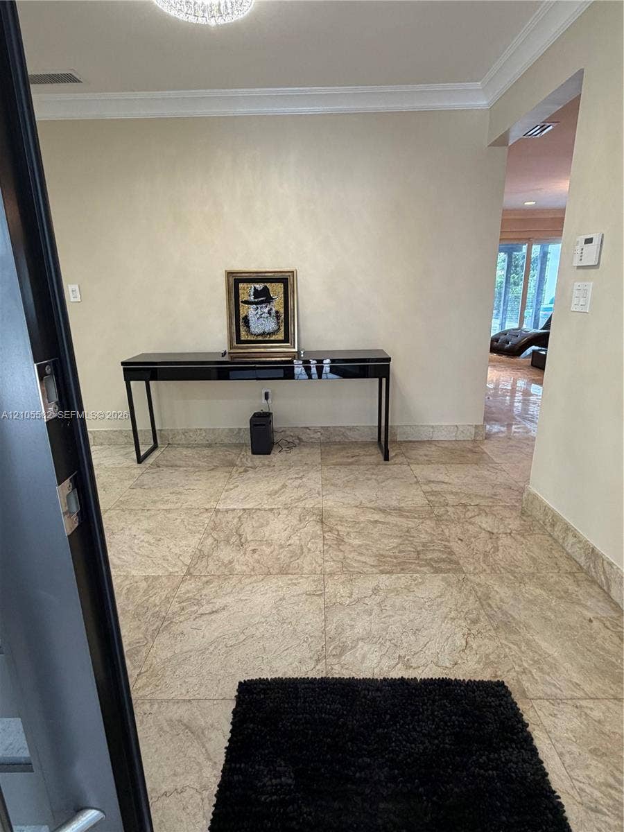2215 NE 204th Street, Miami, Miami, FL 33180 Recessed lighting, crown molding, and large-format tile flooring