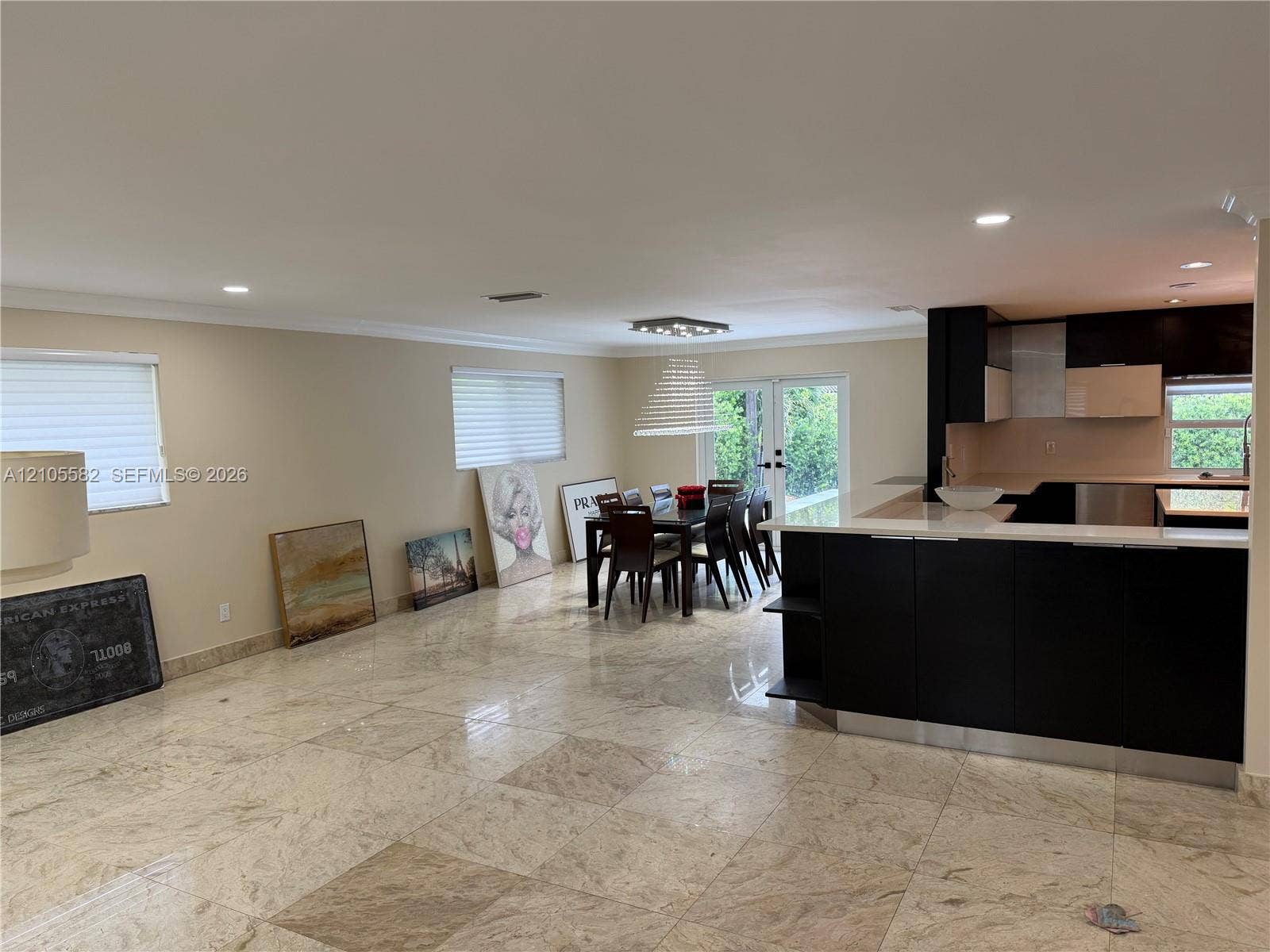 2215 NE 204th Street, Miami, Miami, FL 33180 Tile flooring, recessed lighting, modern kitchen cabinetry, breakfast bar, and glass doors