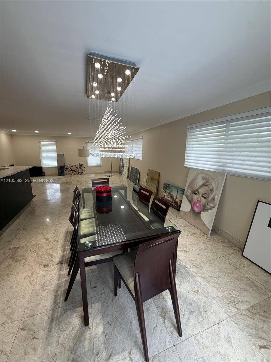 2215 NE 204th Street, Miami, Miami, FL 33180 Recessed lighting, two distinct ceiling light fixtures, large format tile flooring, and multiple windows with blinds