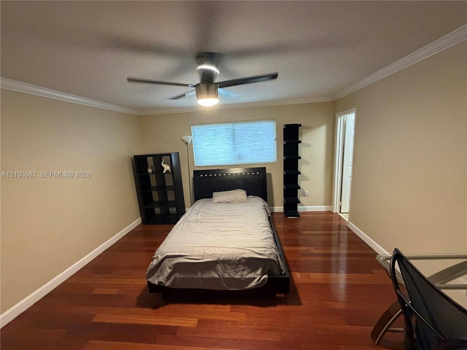 2215 NE 204th Street, Miami, Miami, FL 33180 Wood-finish flooring throughout, crown molding, and a ceiling fan with integrated lighting
