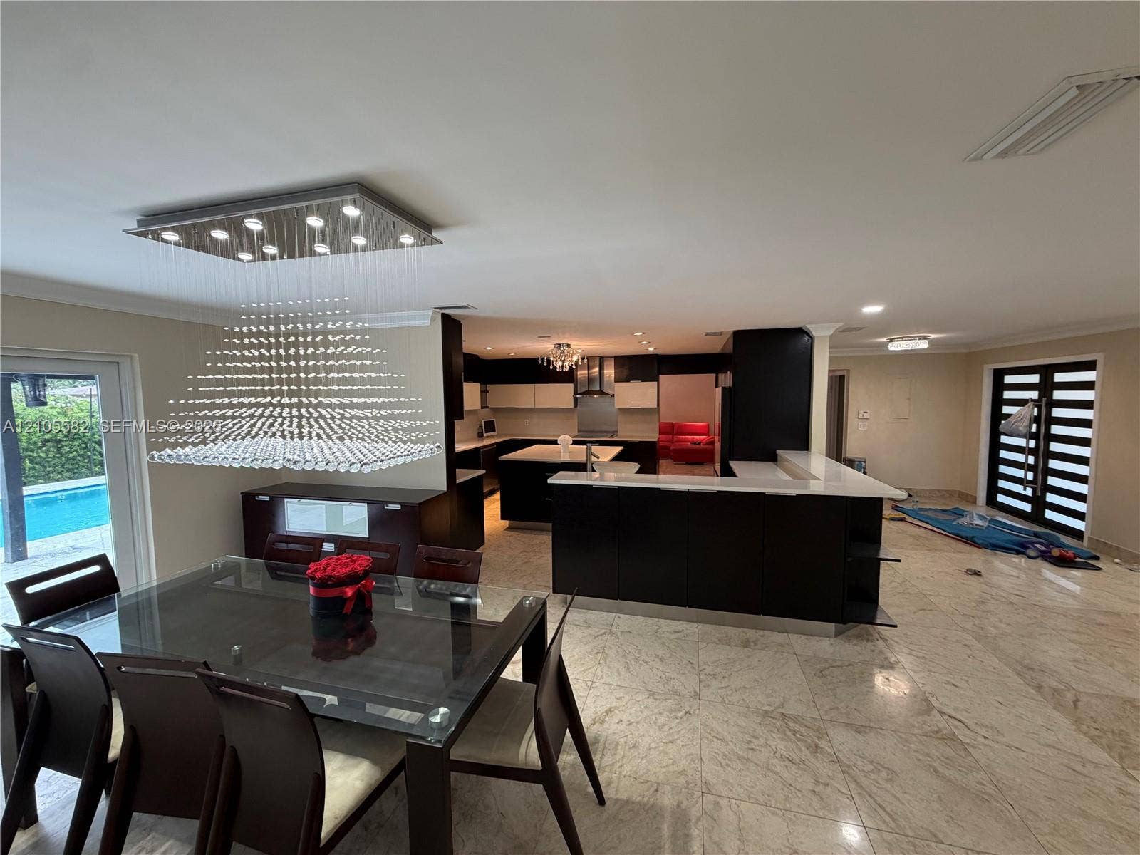 2215 NE 204th Street, Miami, Miami, FL 33180 Open-concept living space with large format tile flooring and recessed lighting