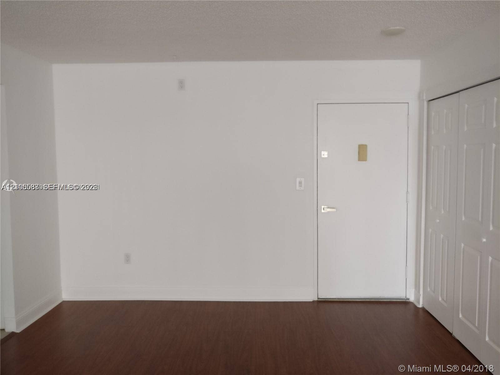 Wood-finish flooring with white walls