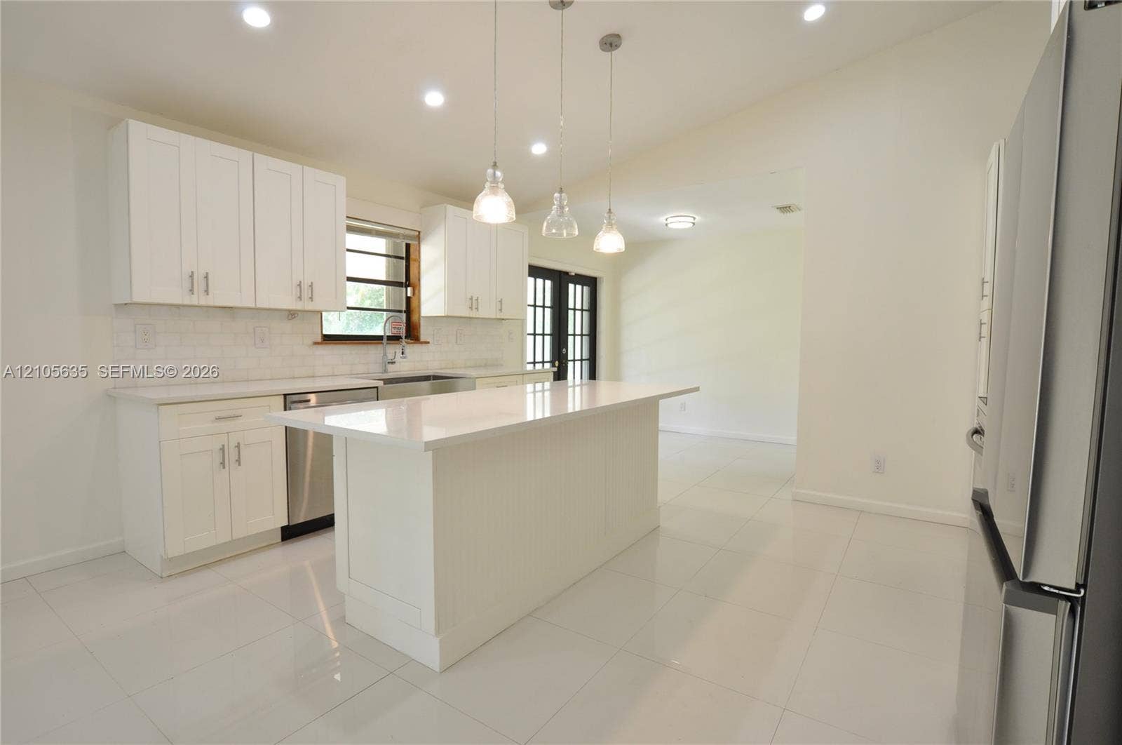 16760 SW 280th Street, Homestead, FL 33031 Kitchen featuring white cabinetry, quartz countertops, a central island, recessed lighting, and stainless steel appliances