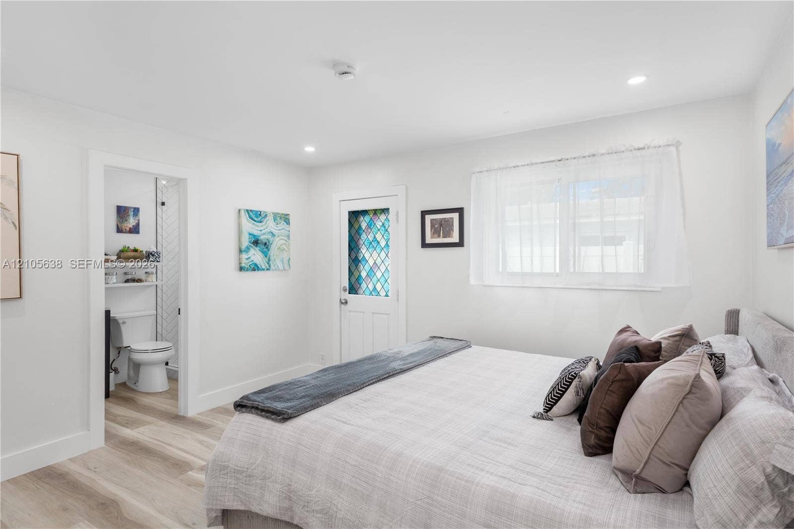 1429 NW 10th Street, #1, Dania, Dania Beach, FL 33004 Wood-finish flooring, recessed lighting, and a door featuring decorative leaded glass inserts