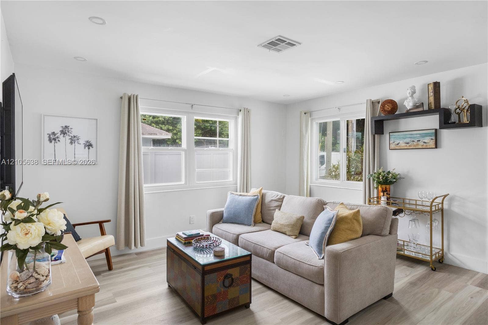 1429 NW 10th Street, #1, Dania, Dania Beach, FL 33004 Living space featuring wood-finish flooring, recessed lighting, and dual windows with grid detailing