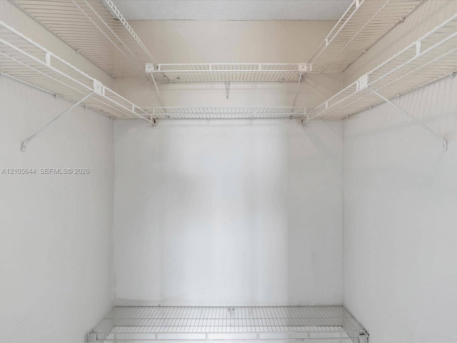 2101 Atlantic Shores Boulevard, #502, Hallandale Beach, Hallandale Beach, FL 33009 Storage space featuring white wire shelving units across three walls and a lower wire shelf