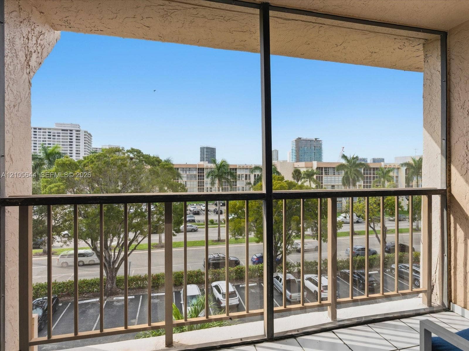 2101 Atlantic Shores Boulevard, #502, Hallandale Beach, Hallandale Beach, FL 33009 Screened-in balcony featuring tile flooring and metal railings