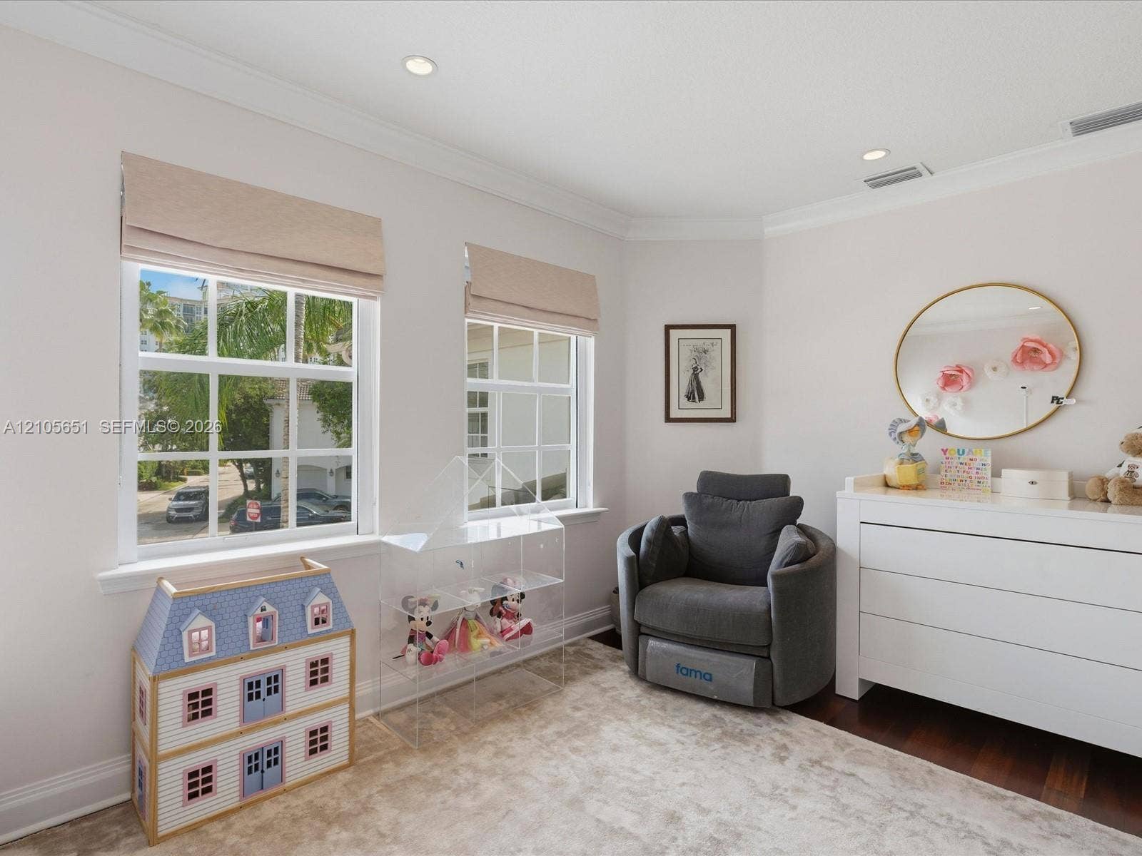 Neutral-toned room featuring crown molding, recessed lighting, grid-pattern windows, and dark-toned flooring