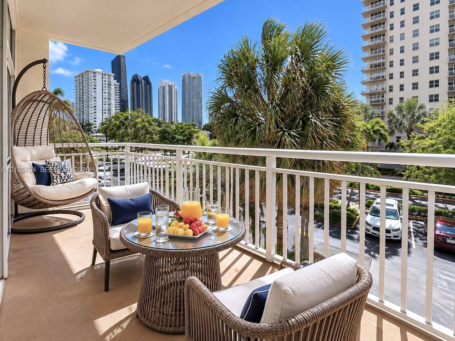 251 174th Street, #212, Sunny Isles Beach, Sunny Isles Beach, FL 33160 Private covered balcony featuring white metal railings and concrete flooring