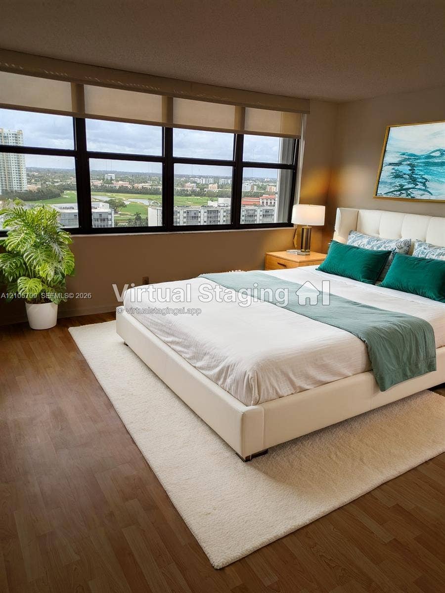 300 Three Islands Boulevard, #516, Hallandale Beach, FL 33009 Floor-to-ceiling windows featuring panoramic urban scenery, wood-finish flooring, and integrated roller shades