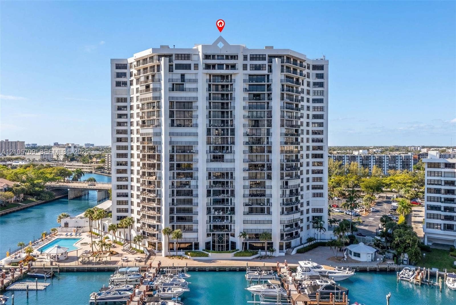 300 Three Islands Boulevard, #516, Hallandale Beach, FL 33009 High-rise waterfront condominium featuring private balconies, an outdoor swimming pool, and an integrated marina with boat slips