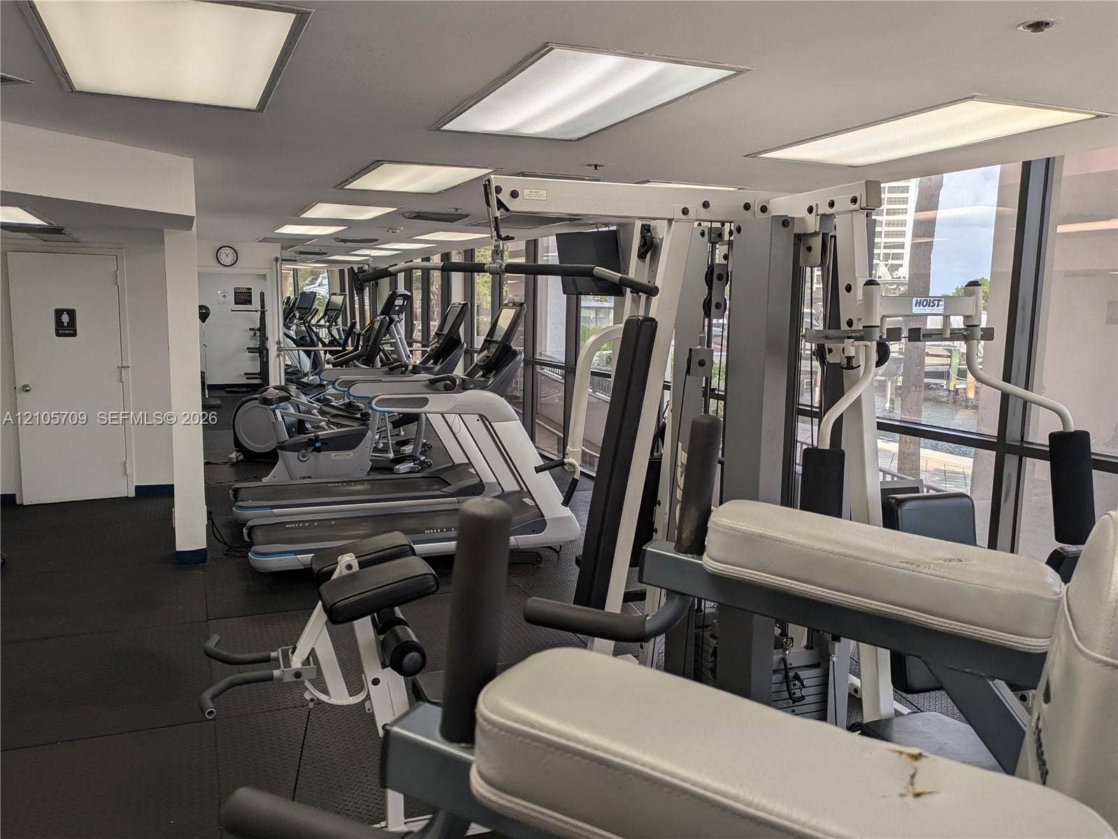 300 Three Islands Boulevard, #516, Hallandale Beach, FL 33009 Fitness facility featuring rubberized flooring, expansive floor-to-ceiling windows, and recessed panel lighting