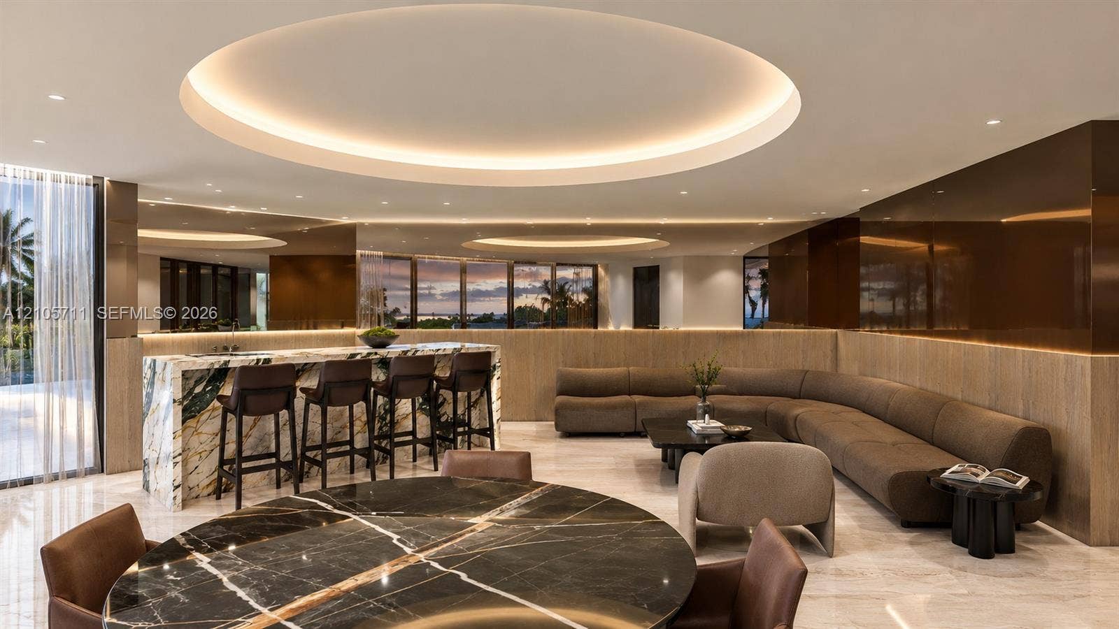 839 Orchid Drive, Boca Raton, FL 33432 Expansive living area featuring circular recessed ceiling detailing, stone-topped bar island with integrated sink, floor-to-ceiling mirror panels, high-gloss wall cladding, and stone flooring throughout