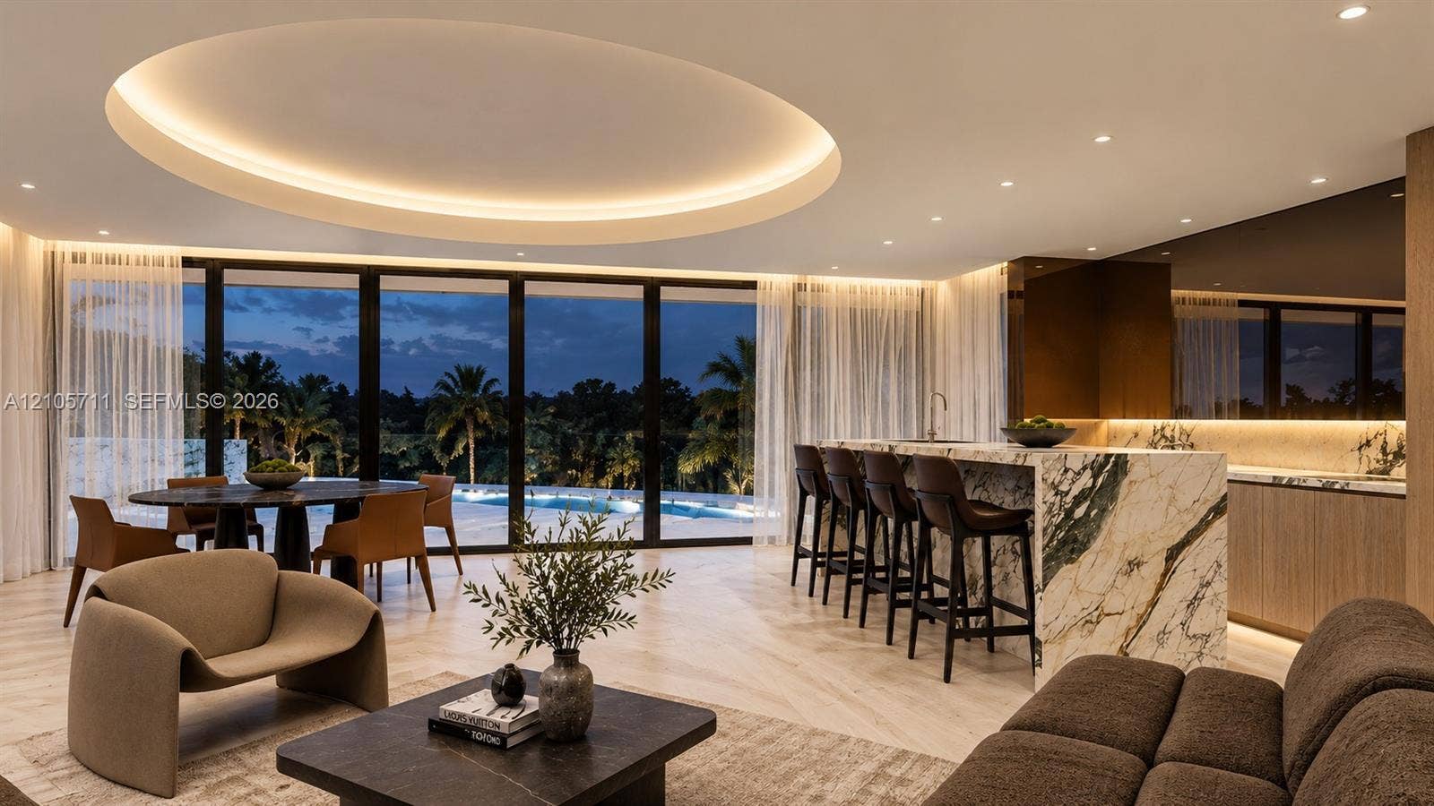 839 Orchid Drive, Boca Raton, FL 33432 Expansive interior featuring a recessed circular tray ceiling with integrated perimeter lighting, floor-to-ceiling glass wall, light-toned wood-finish flooring, and a large kitchen island with a stone-surfaced waterfall edge