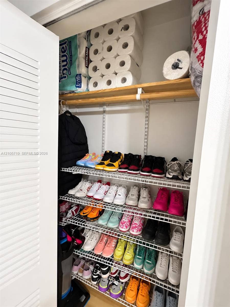 1 Glen Royal Parkway, #1510, Miami, FL 33125 Storage closet featuring tiered wire shelving and a finished wood top shelf