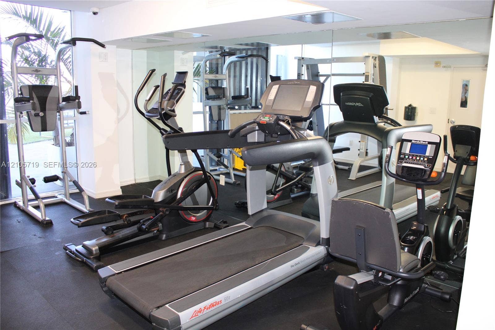 1 Glen Royal Parkway, #1510, Miami, FL 33125 Fitness facility featuring full-wall mirrors and high-impact rubber flooring