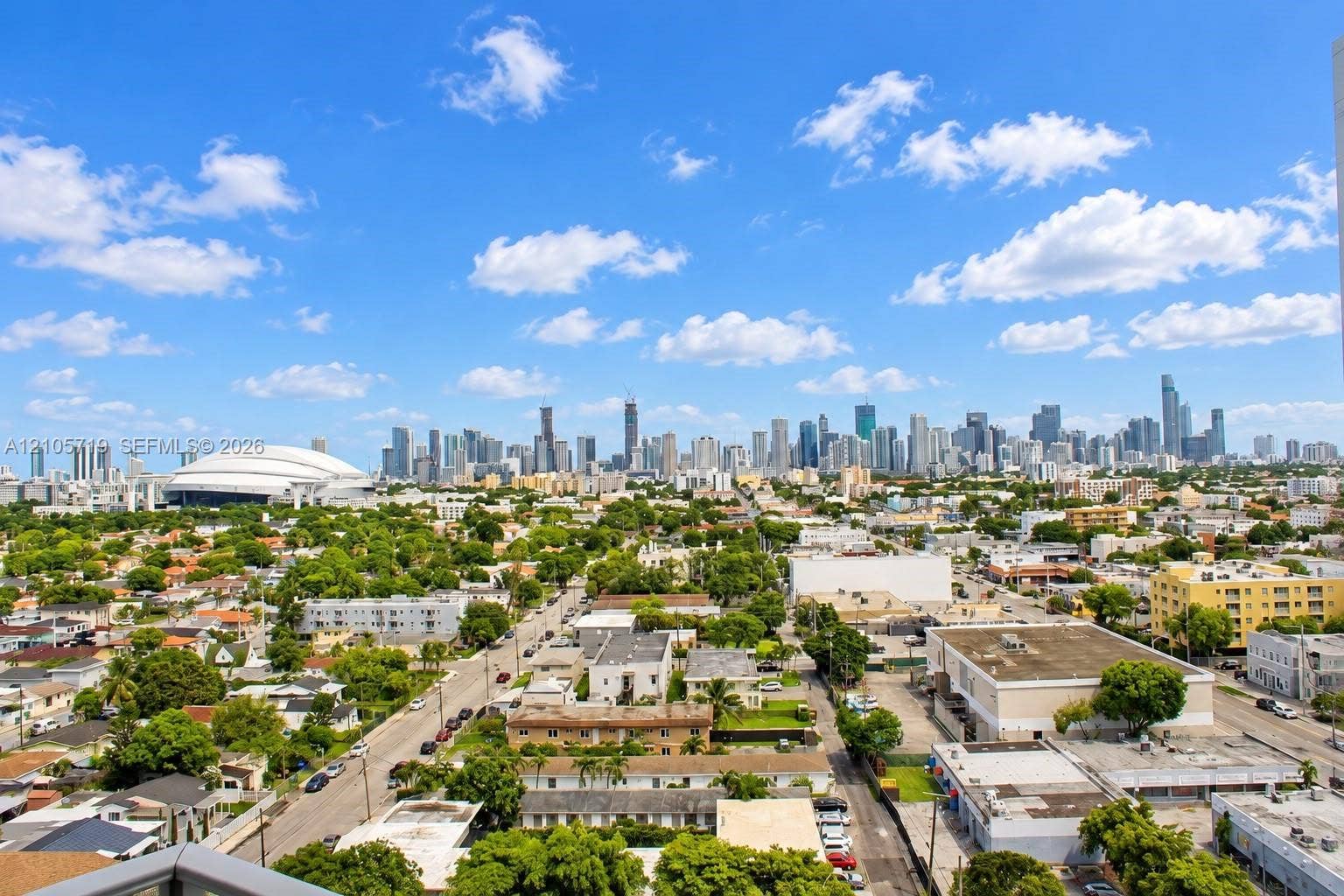 1 Glen Royal Parkway, #1510, Miami, FL 33125 Elevated perspective showcasing an expansive urban skyline and a prominent domed stadium