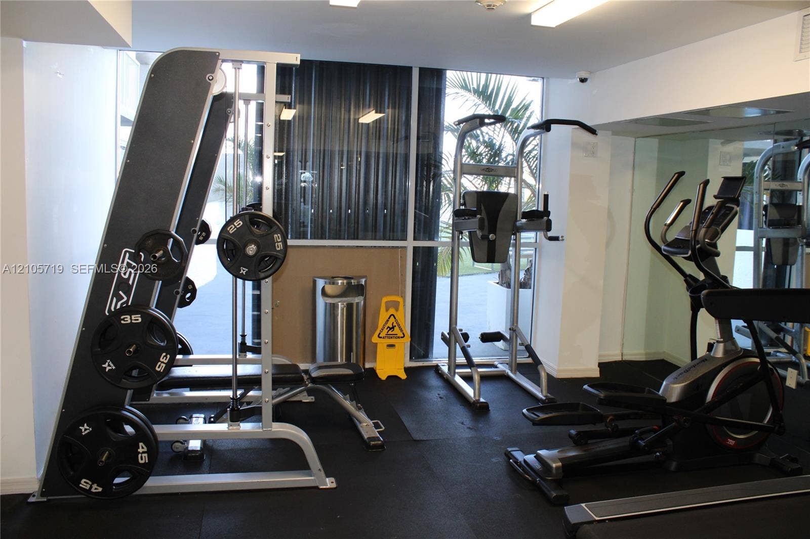 1 Glen Royal Parkway, #1510, Miami, FL 33125 Fitness center featuring rubberized flooring, mirrored walls, and floor-to-ceiling windows