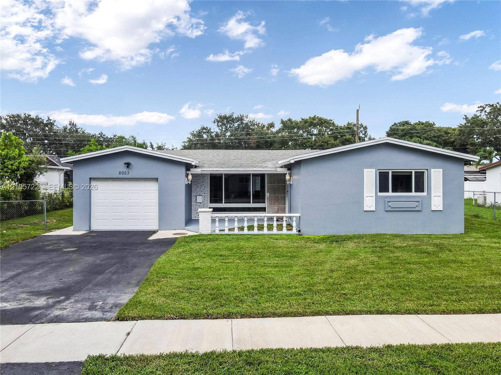 8953 SW 53rd Street, Cooper City, FL 33328 Paved street lined with mature shade trees and manicured lawns