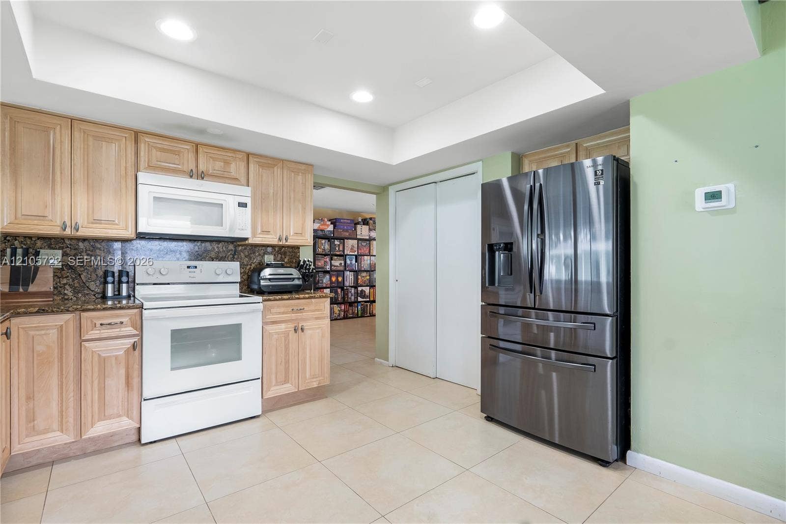 8953 SW 53rd Street, Cooper City, FL 33328 Kitchen featuring light-finish cabinetry, stone countertops, recessed lighting, tile flooring, and stainless steel appliances