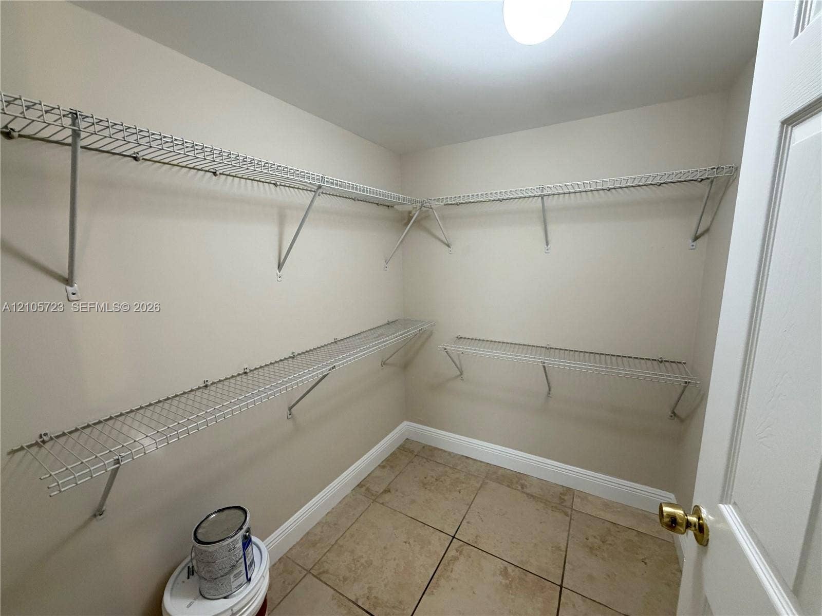 4785 SW 62nd Avenue, #102, Davie, Davie, FL 33314 Walk-in storage space featuring multi-level wire shelving and tile flooring