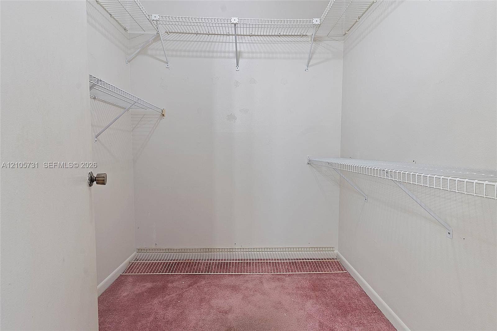 5700 SW 127th Avenue, #1404, Miami, FL 33183 Storage area featuring wall-to-wall carpeting and multi-level white wire shelving