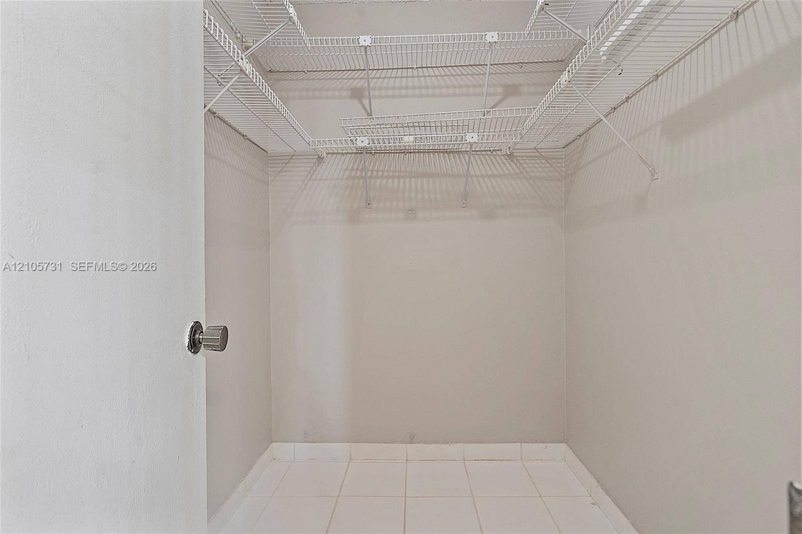 5700 SW 127th Avenue, #1404, Miami, FL 33183 Storage area featuring white wire shelving and tile flooring