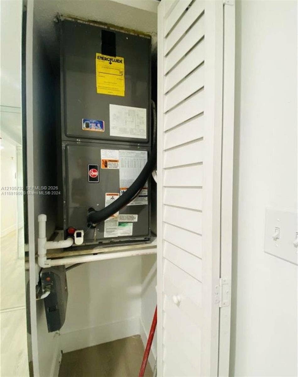 5249 NW 7th Street, #219, Miami, Miami, FL 33126 Dedicated utility closet featuring an air handler unit and louvered folding access door