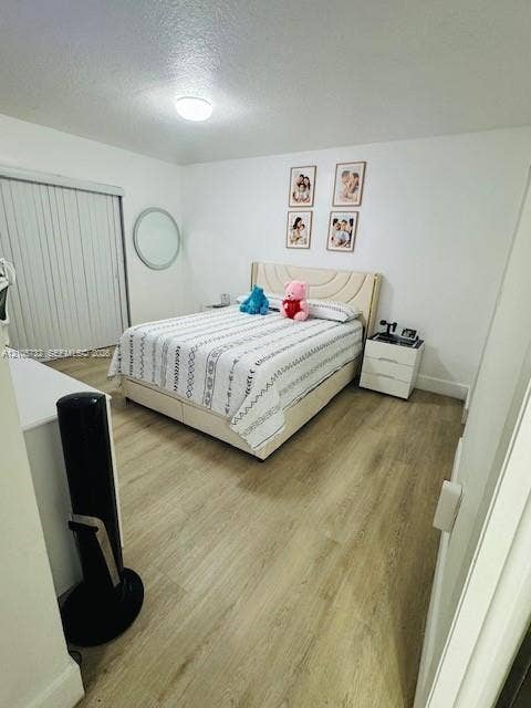 5249 NW 7th Street, #219, Miami, Miami, FL 33126 Wood-finish flooring, flush-mount ceiling lighting, and sliding closet doors