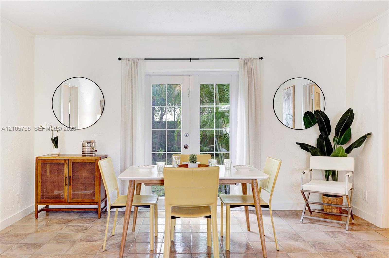 668 NE 70th Street, Miami, FL 33138 White-framed French doors with glass panes and tile flooring