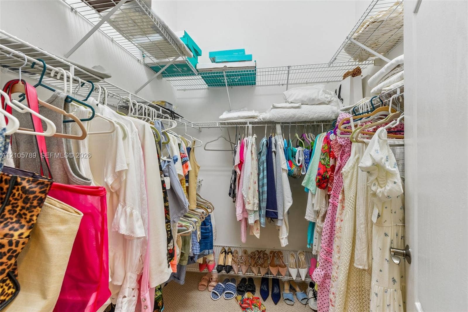 6353 SW 191st Avenue, Pembroke Pines, FL 33332 Walk-in storage space featuring multi-tiered white wire shelving systems