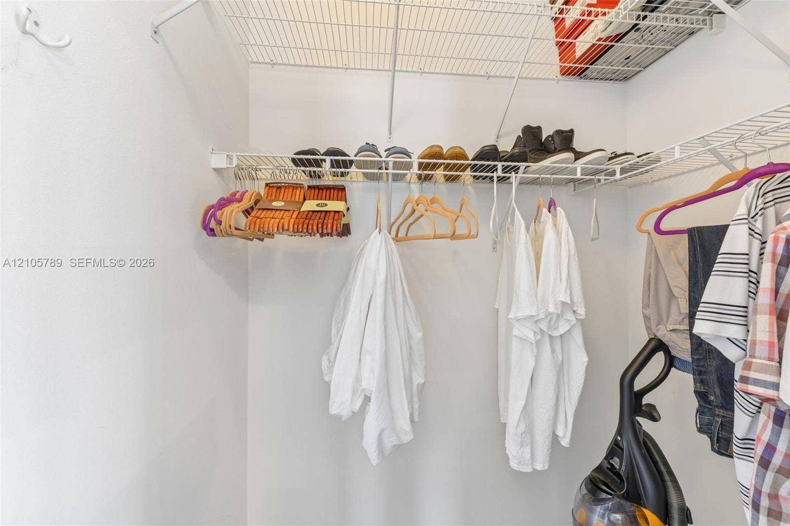 6353 SW 191st Avenue, Pembroke Pines, FL 33332 Walk-in closet featuring multi-level white wire shelving and a wall-mounted hook
