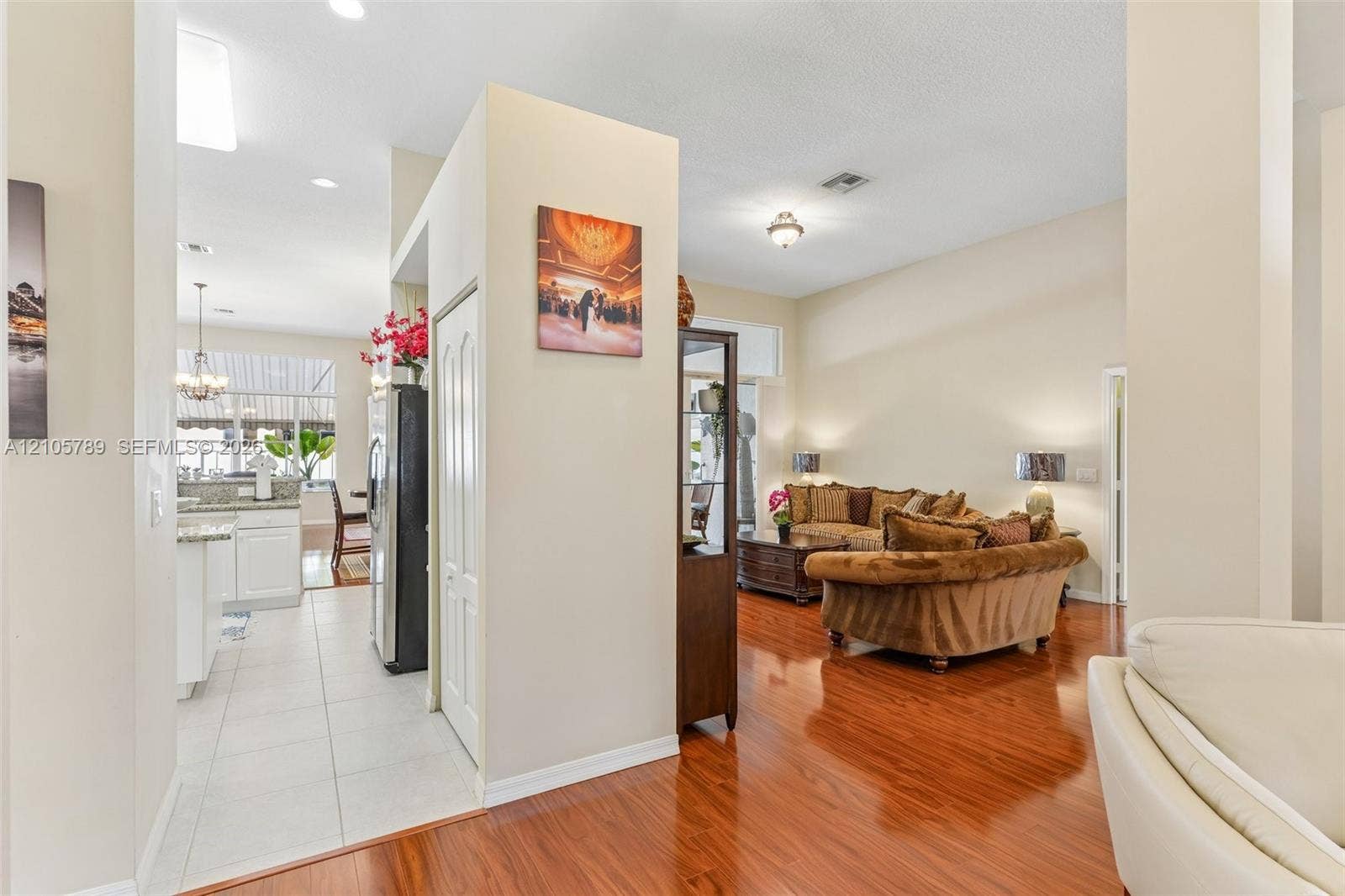 6353 SW 191st Avenue, Pembroke Pines, FL 33332 Interior featuring wood-finish flooring, ceramic tile flooring, neutral wall paint, recessed lighting, and high ceilings