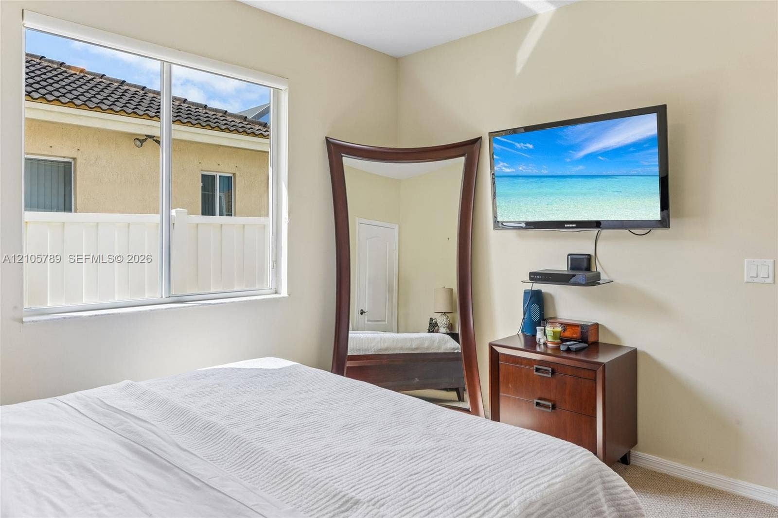 6353 SW 191st Avenue, Pembroke Pines, FL 33332 Neutral wall tones, dual-pane slider window, and crisp white interior door
