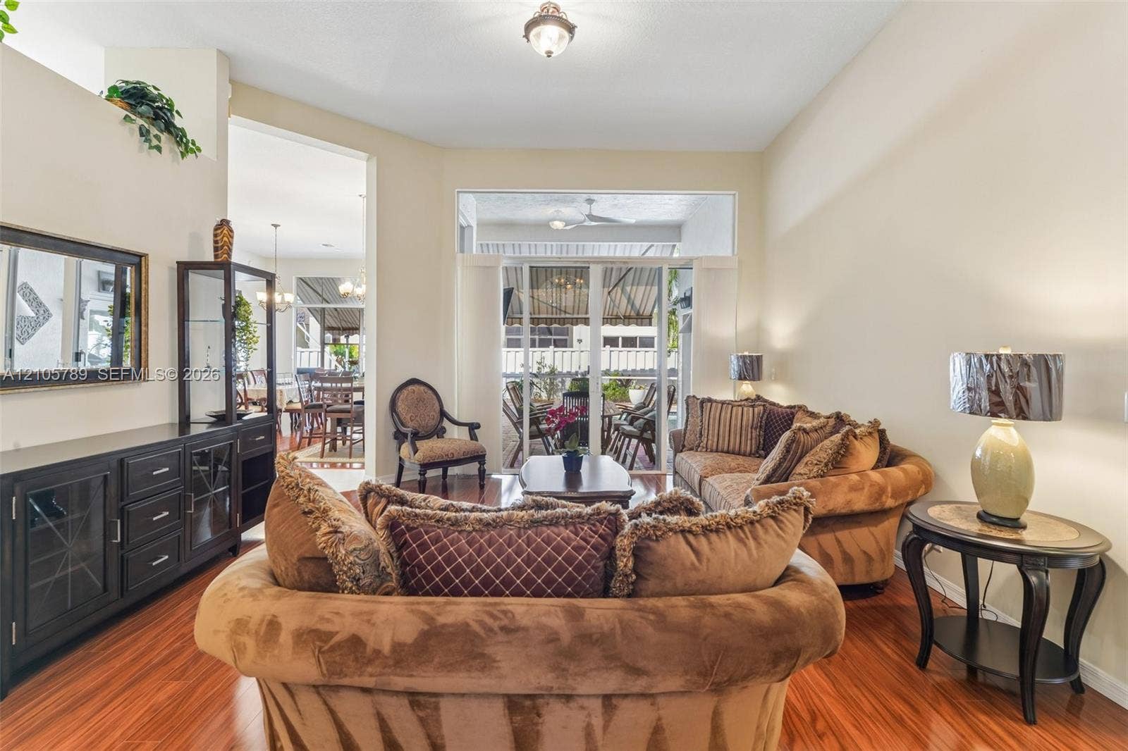 6353 SW 191st Avenue, Pembroke Pines, FL 33332 Vaulted ceilings, wood-finish flooring, recessed lighting, and large sliding glass doors with transom windows