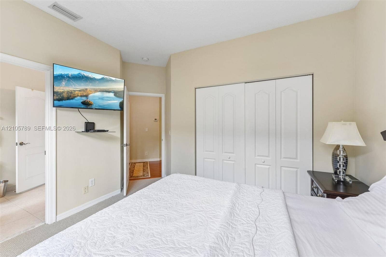 6353 SW 191st Avenue, Pembroke Pines, FL 33332 Vaulted ceilings, neutral wall palette, and double-door closet with paneled detailing
