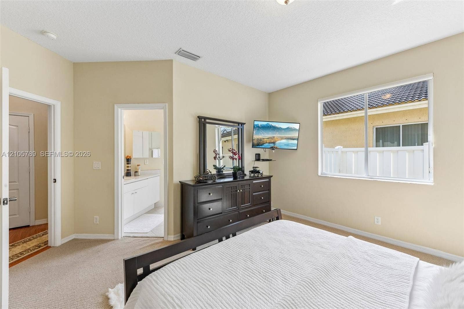 6353 SW 191st Avenue, Pembroke Pines, FL 33332 Neutral wall finishes, plush carpeting, multi-panel interior doors, and a large window featuring natural light