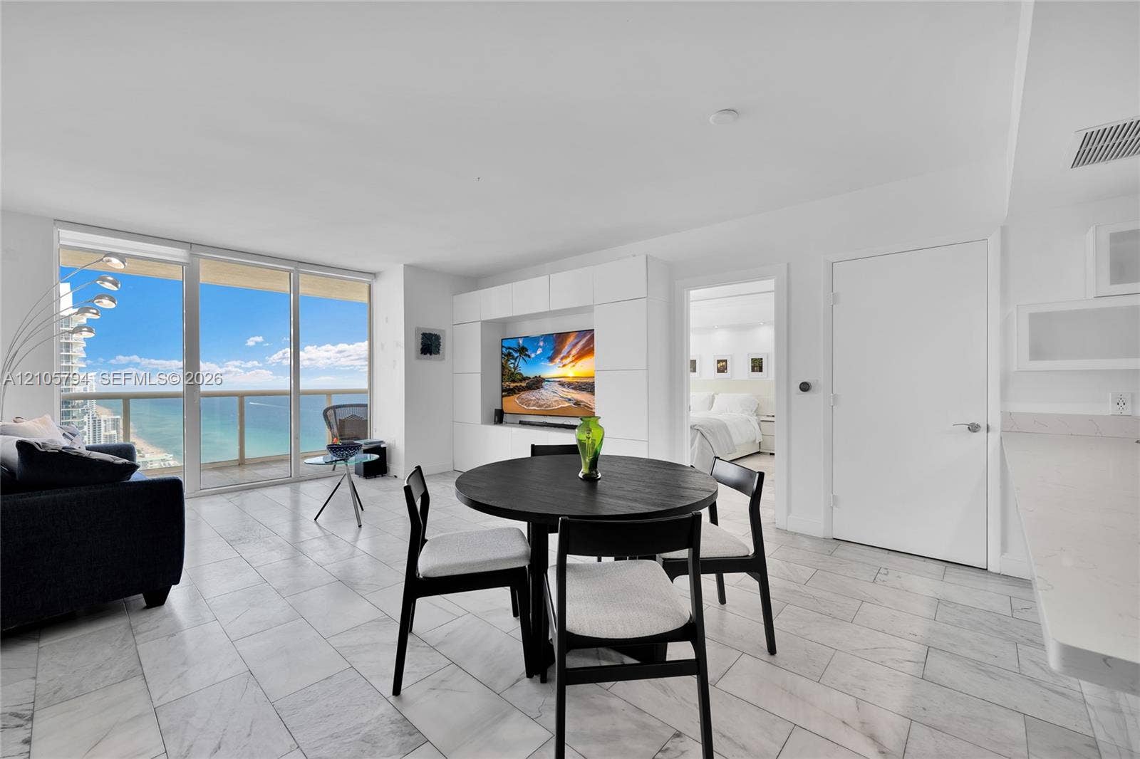 1830 S Ocean Drive, #4210, Hallandale Beach, Hallandale Beach, FL 33009 Open-concept interior featuring floor-to-ceiling glass paneling, tile flooring, and custom built-in cabinetry