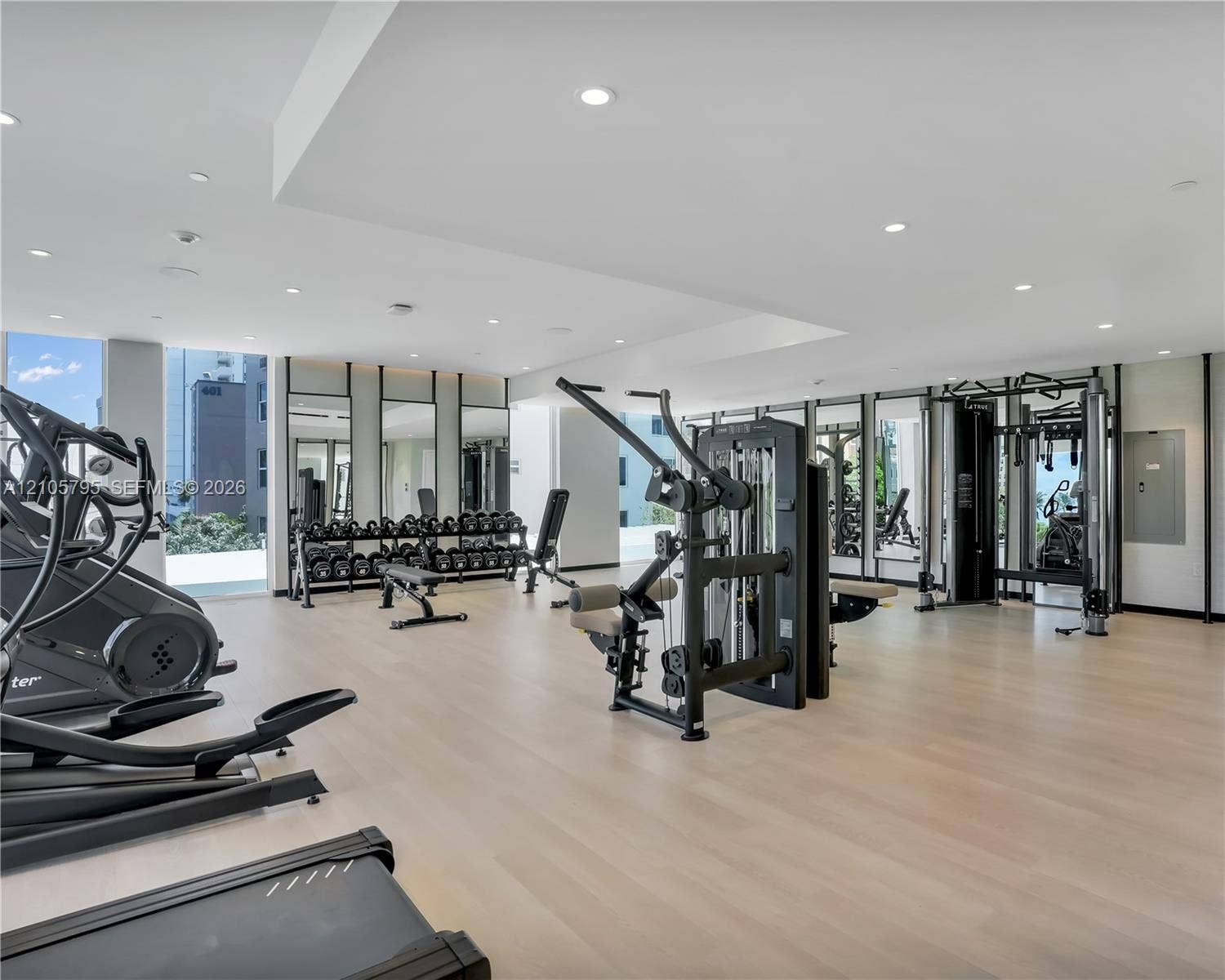 407 N Riverside Drive, #202, Pompano Beach, Pompano Beach, FL 33062 Fitness center featuring wood-finish flooring, recessed lighting, and full-length wall mirrors
