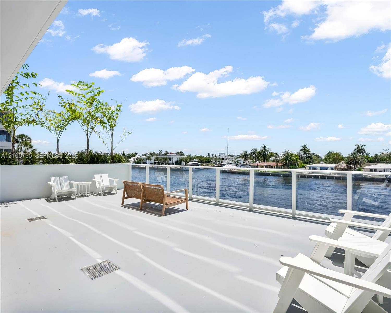 407 N Riverside Drive, #202, Pompano Beach, Pompano Beach, FL 33062 Expansive open-air balcony featuring a solid surface floor and a protective glass panel railing