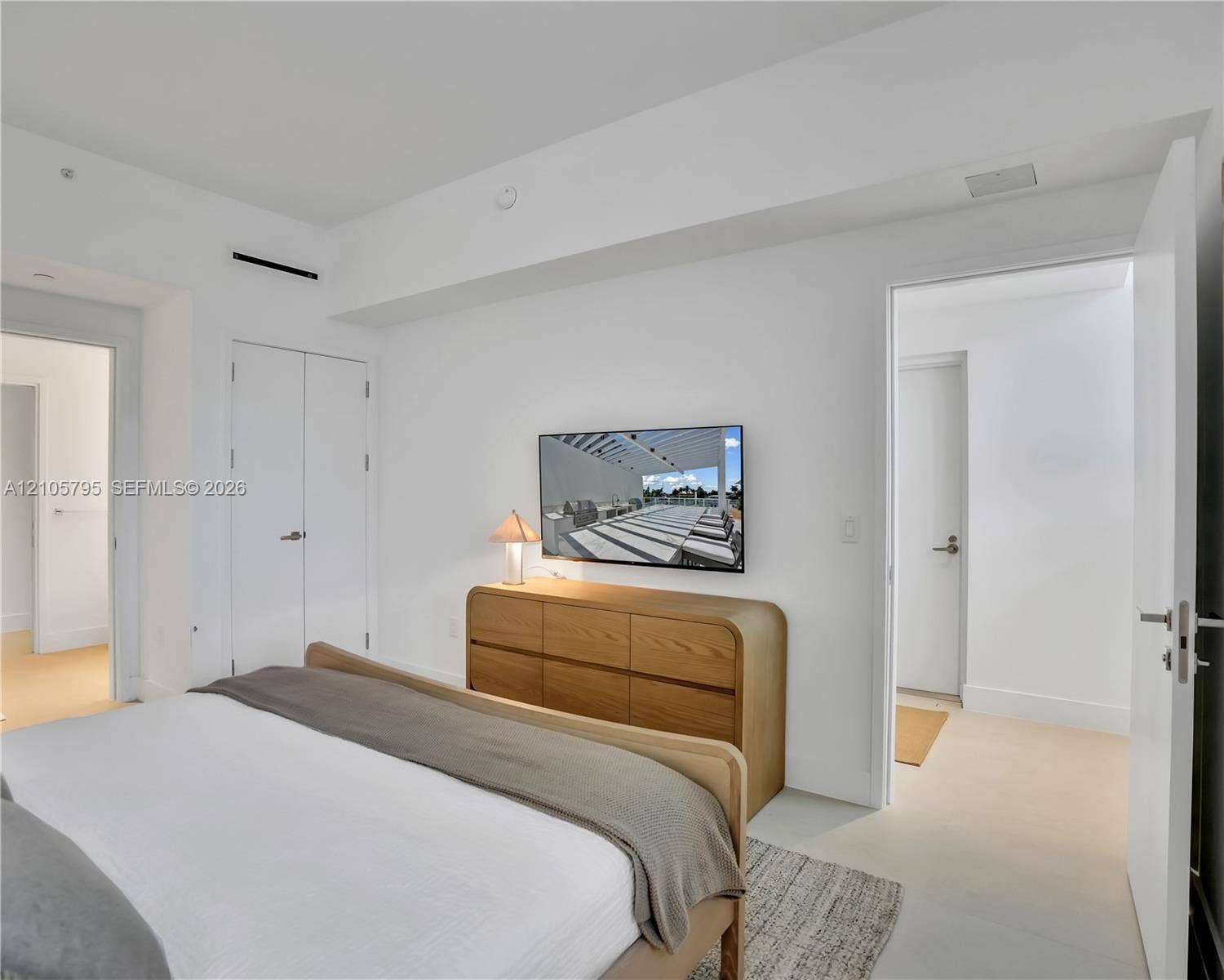 407 N Riverside Drive, #202, Pompano Beach, Pompano Beach, FL 33062 Neutral interior featuring high ceilings, smooth white walls, recessed lighting, and solid-core doors