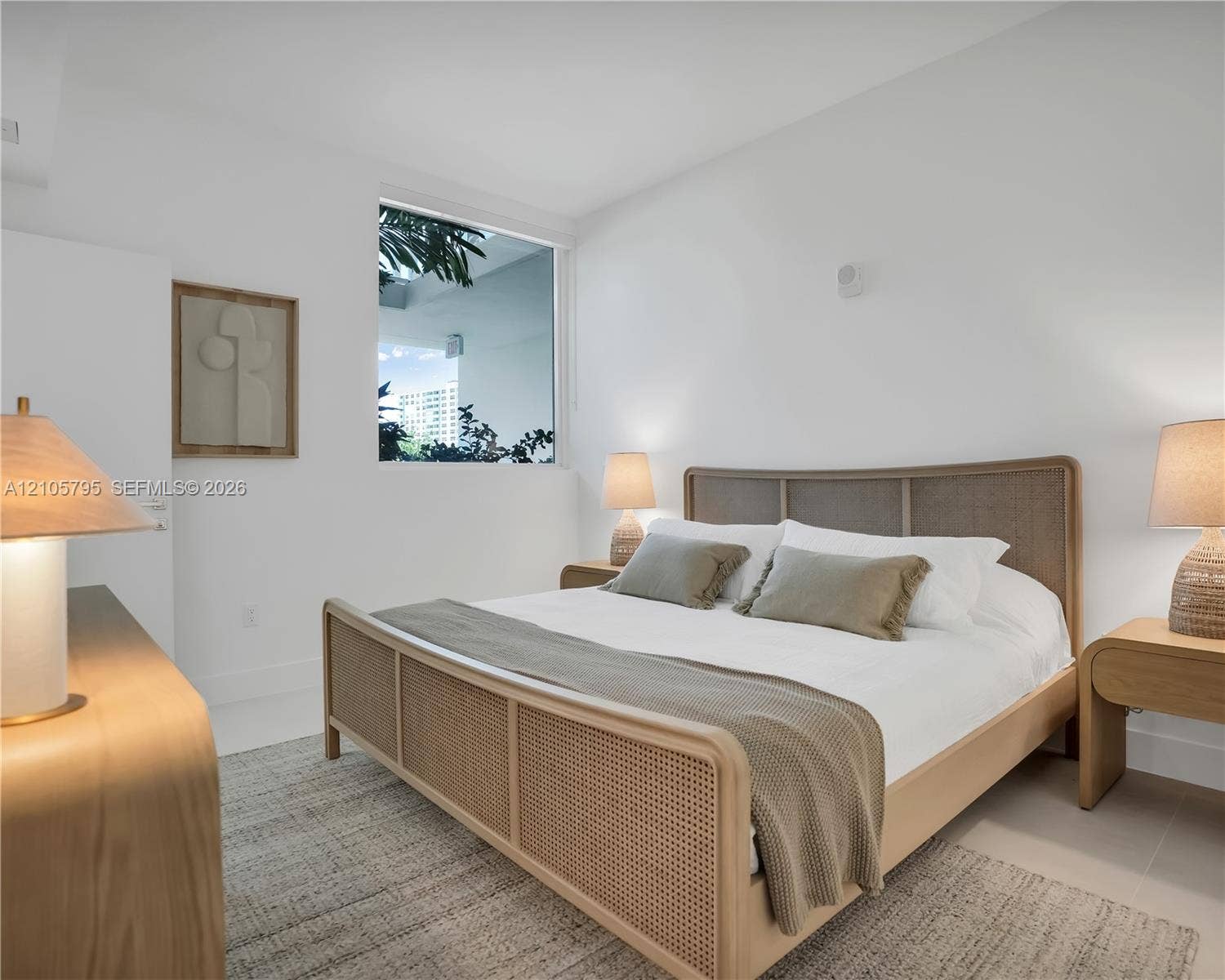 407 N Riverside Drive, #202, Pompano Beach, Pompano Beach, FL 33062 Bright room featuring neutral wall finishes, large-format tile flooring, and a fixed, square-profile window